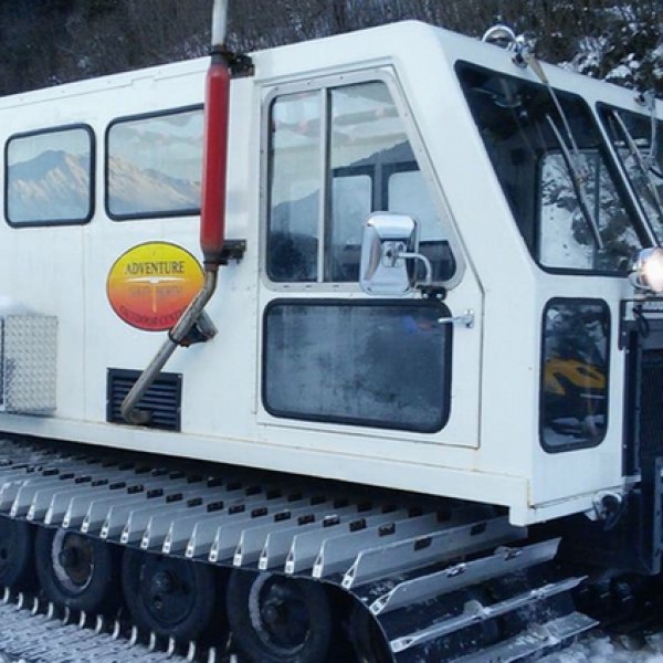 a truck is parked in front of a bus