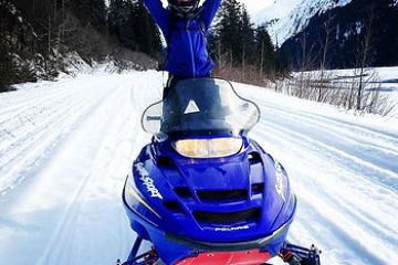 a person that is standing in the snow