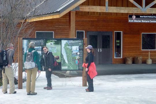 a group of people standing outside of a building