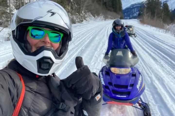 a group of people that are standing in the snow