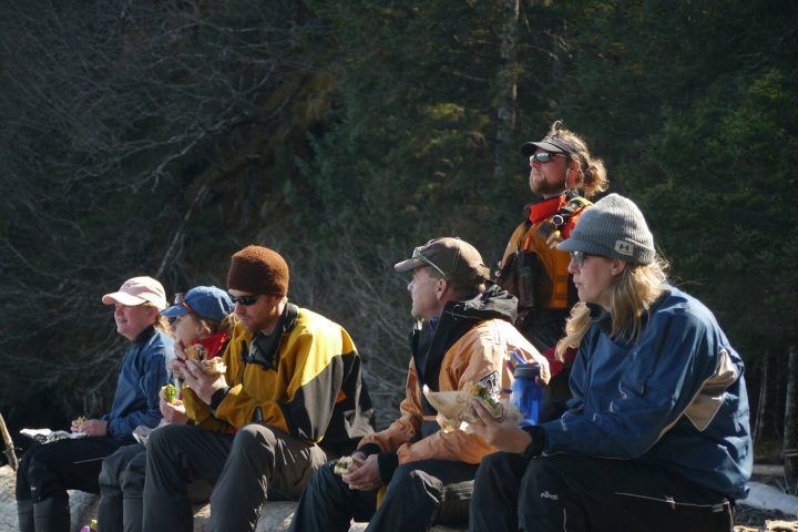 a group of people sitting on a bench
