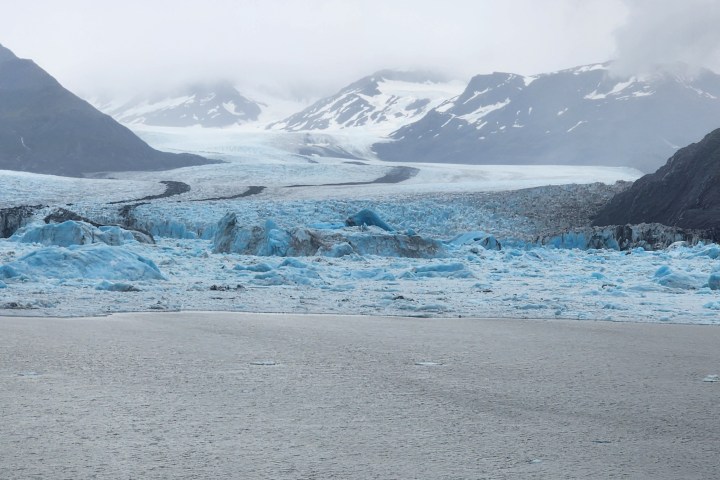 a beach with a mountain in the background