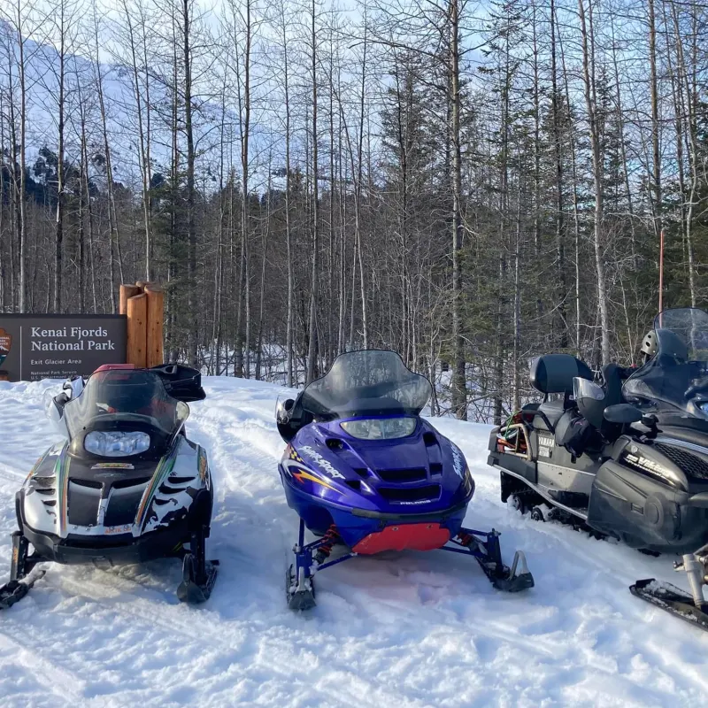 a snowmobile parked in the snow