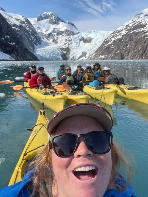 a group of people on a boat in the water
