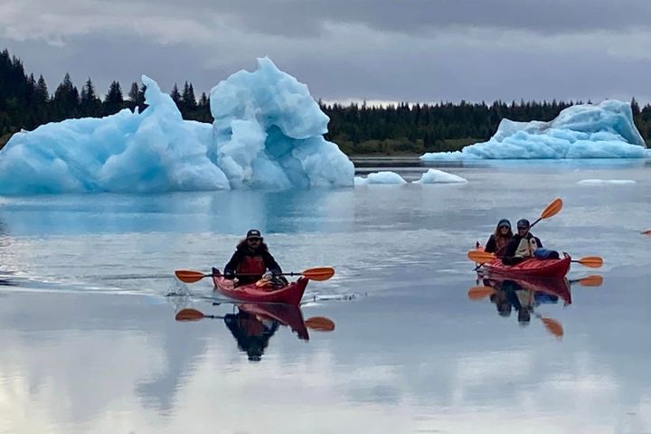 a group of people on a boat in the water