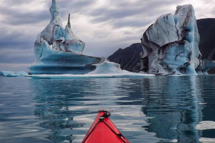 a group of people in a boat on a body of water