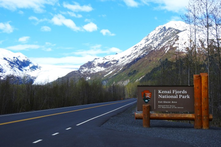 a sign on the side of a mountain road