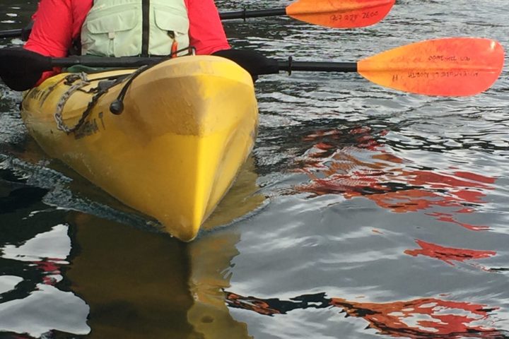 a person sitting on a raft in the water