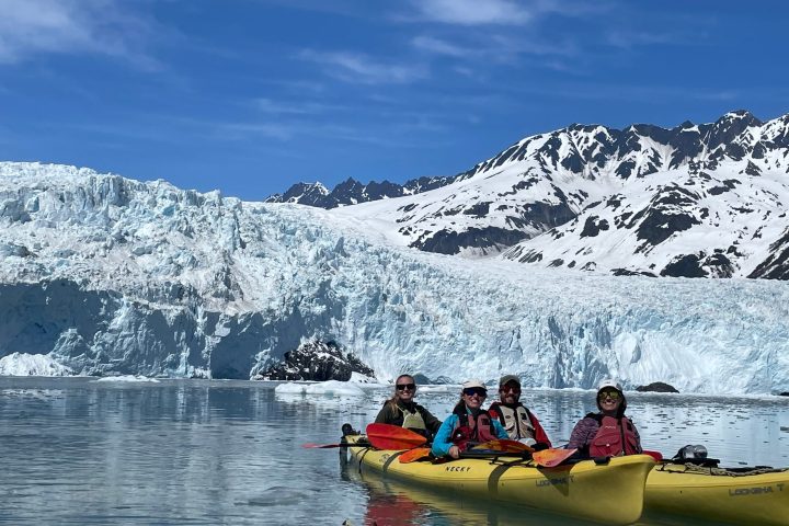 a group of people riding on the back of a boat