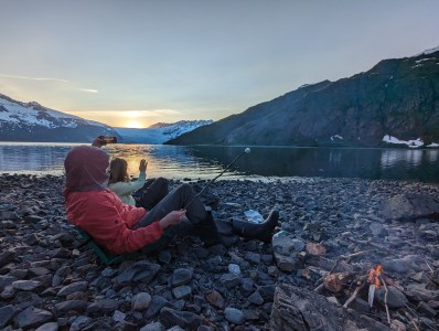 a body of water with a mountain in the background