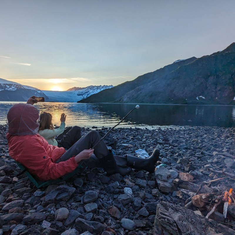a body of water with a mountain in the background