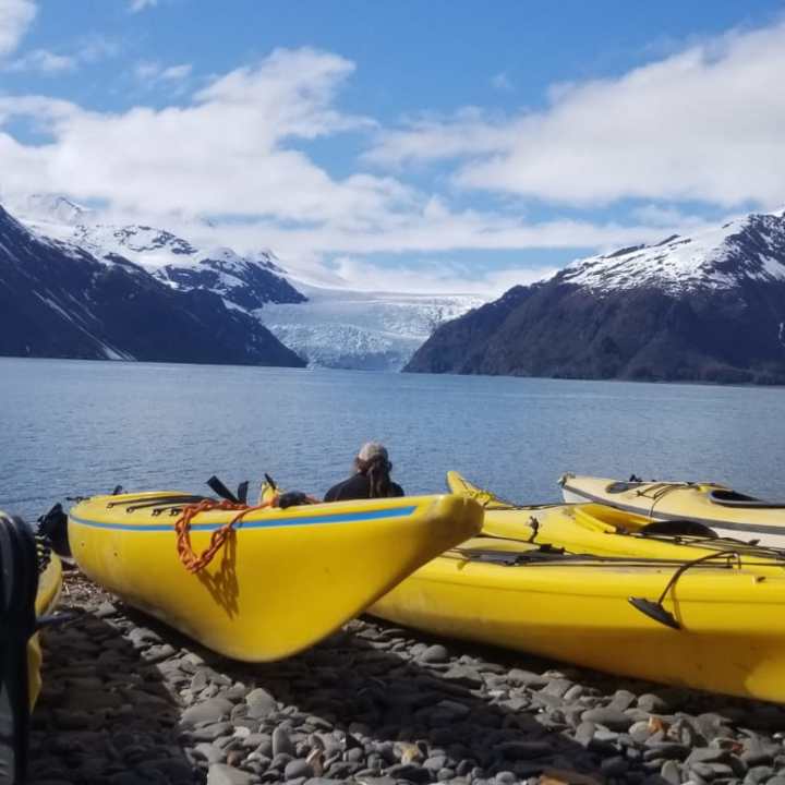 a boat sitting on top of a snow covered mountain