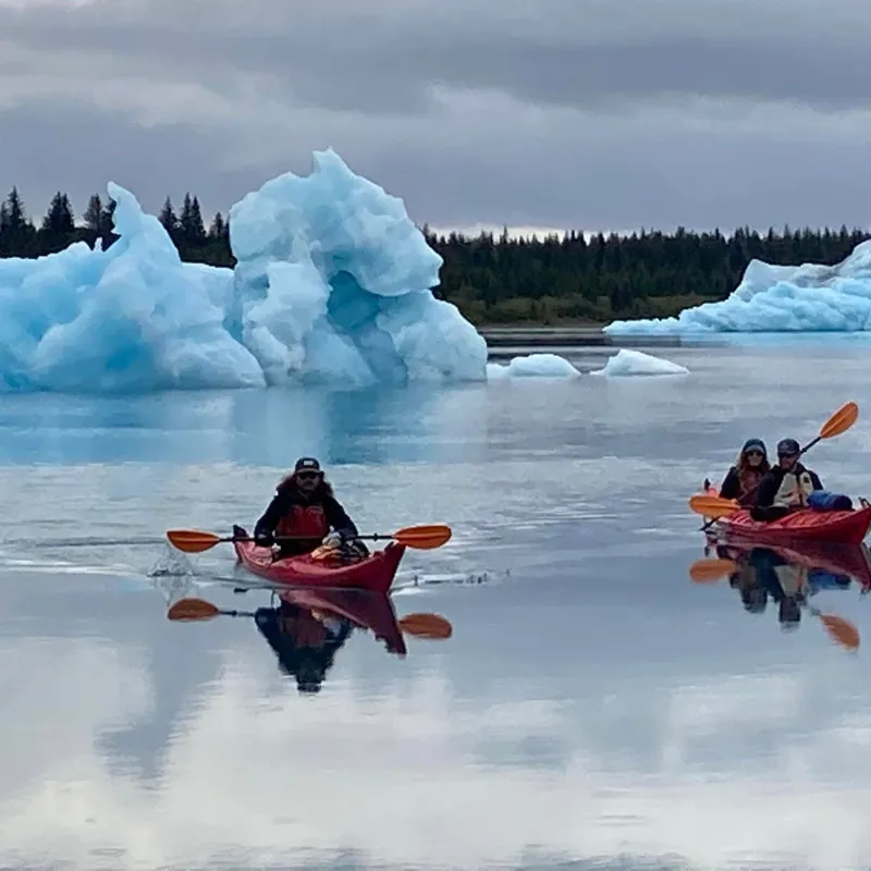 a group of people on a boat in the water