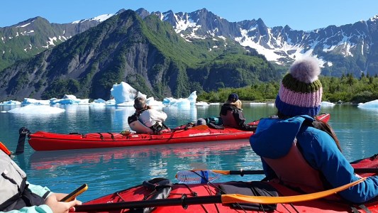 a group of people on a boat in the water