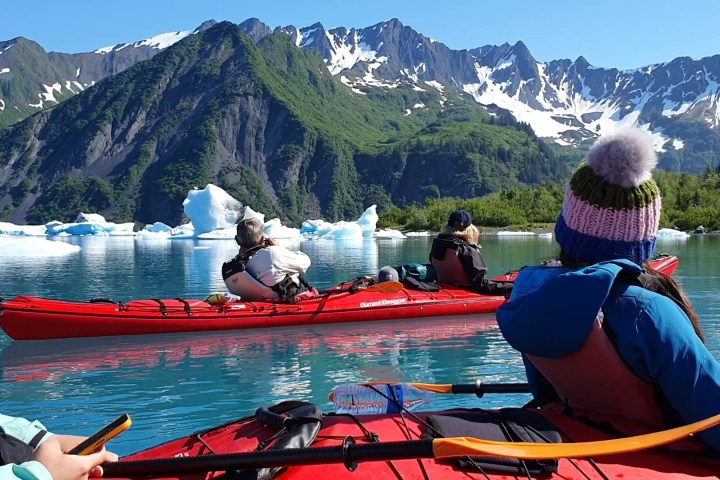 a group of people on a boat in the water