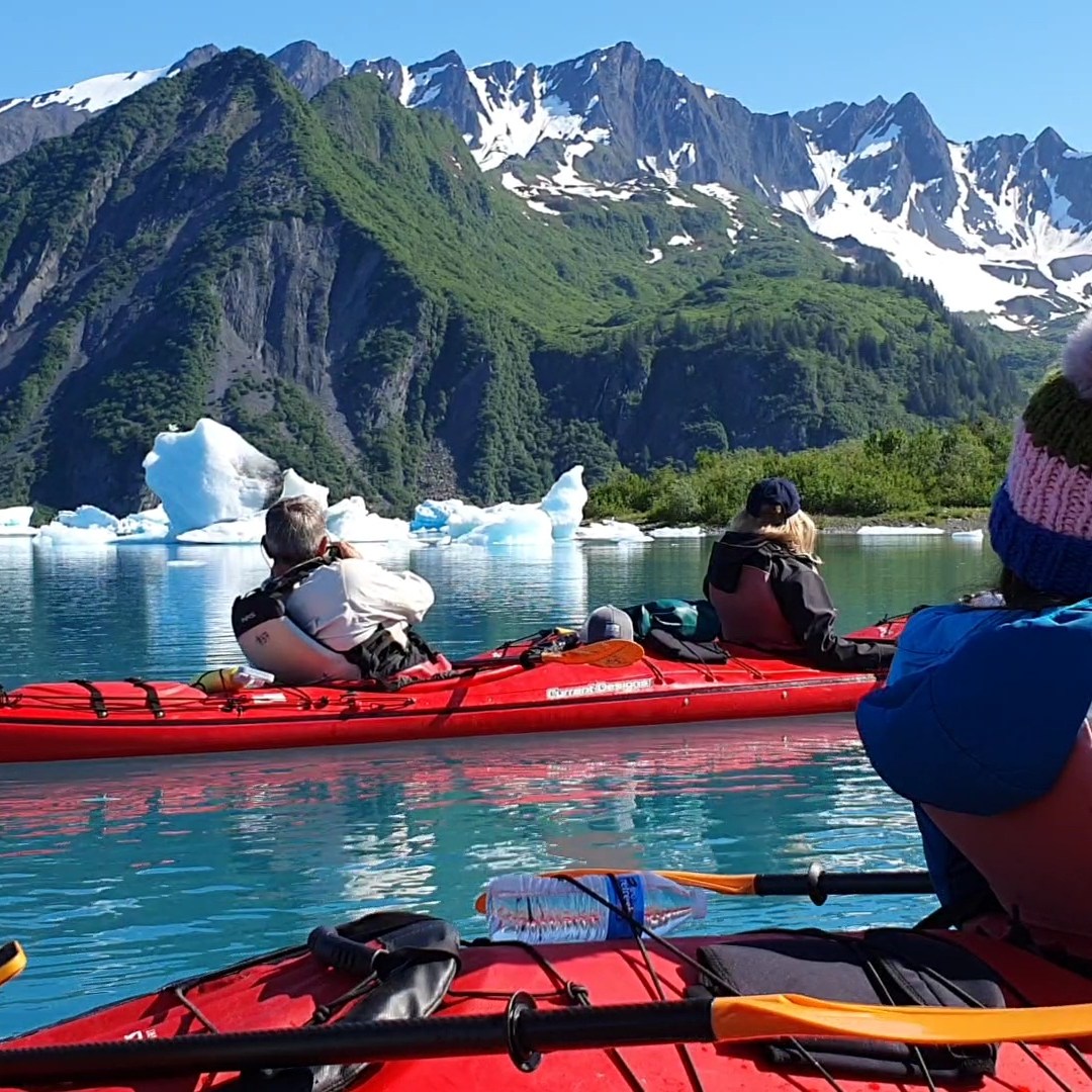 a group of people on a boat in the water