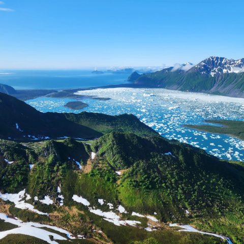 a body of water with a mountain in the background