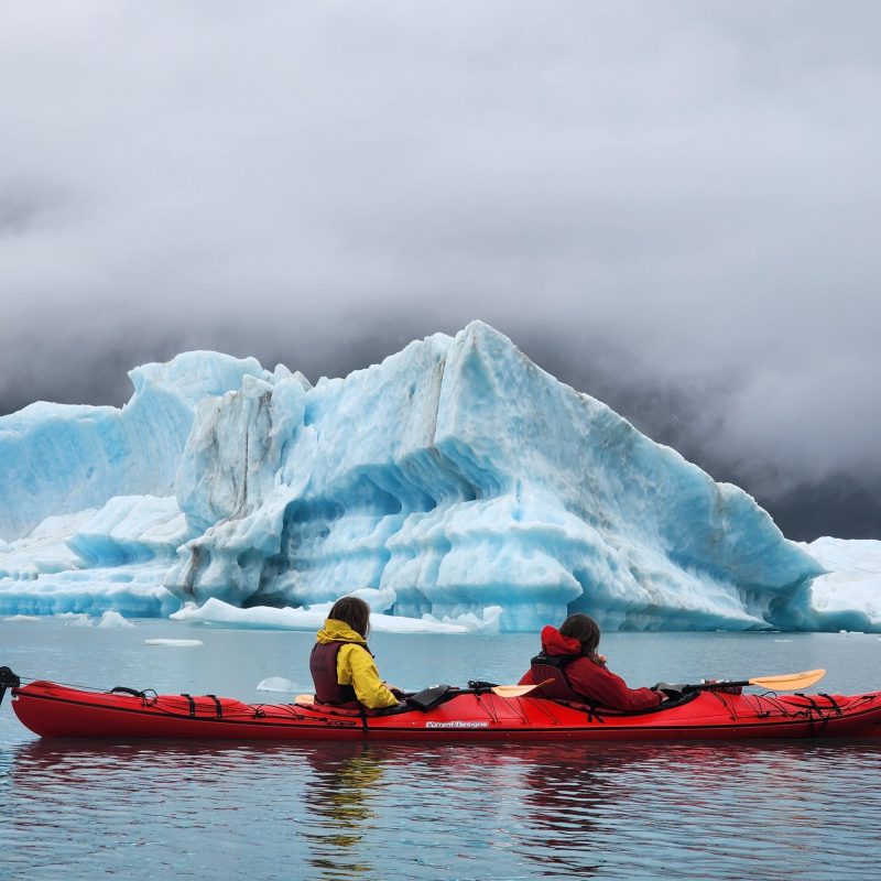 a boat sitting on top of a snow covered mountain