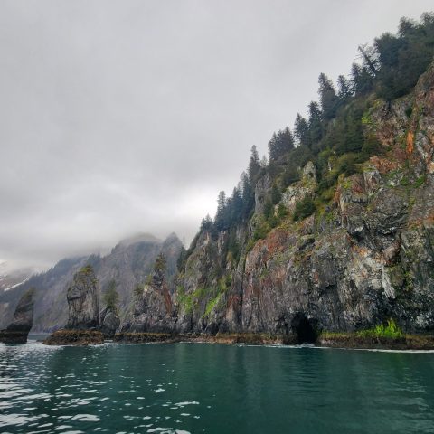 a large waterfall over a body of water