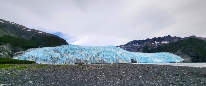 a body of water with a mountain in the background