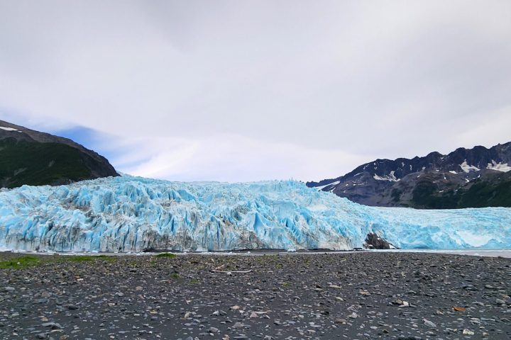 a body of water with a mountain in the background