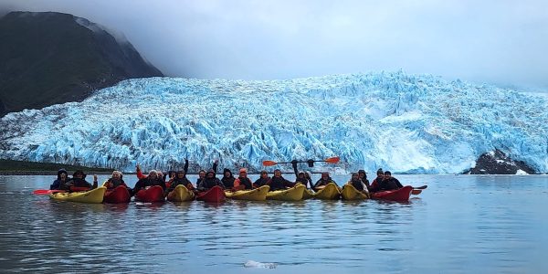 a group of people on a boat in the water