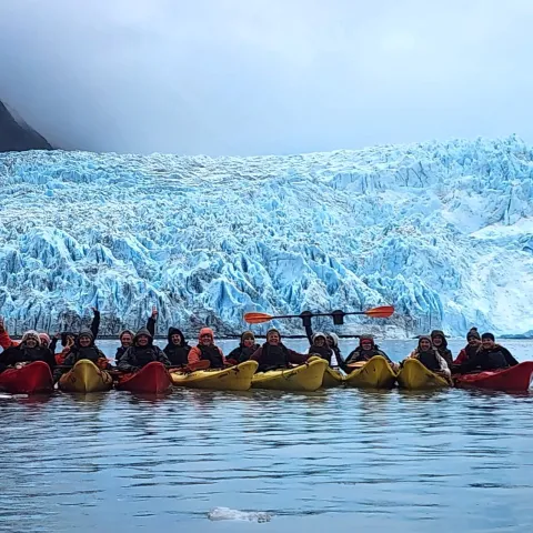 a group of people on a boat in the water
