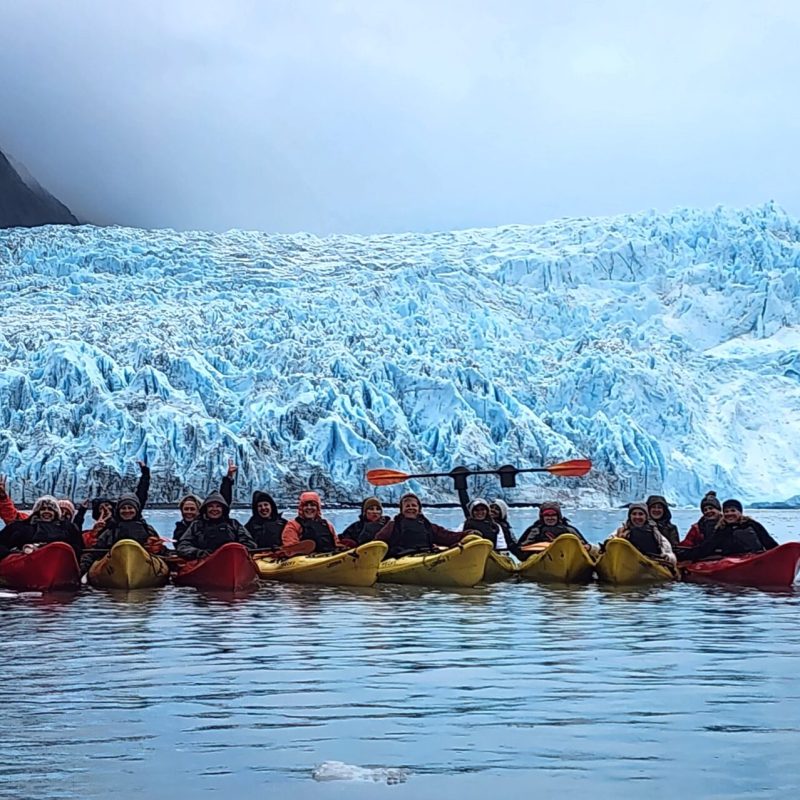 a group of people on a boat in the water