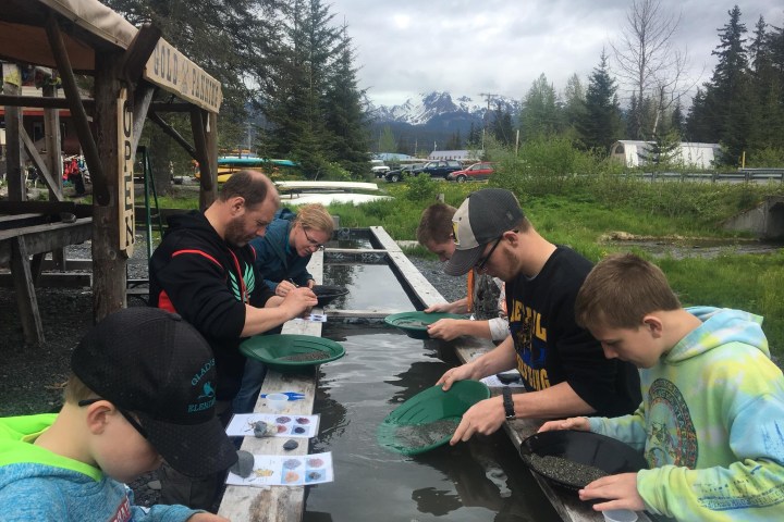a group of people sitting at a picnic table