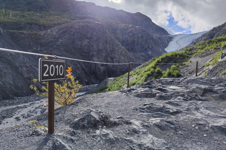 a sign on the side of a mountain