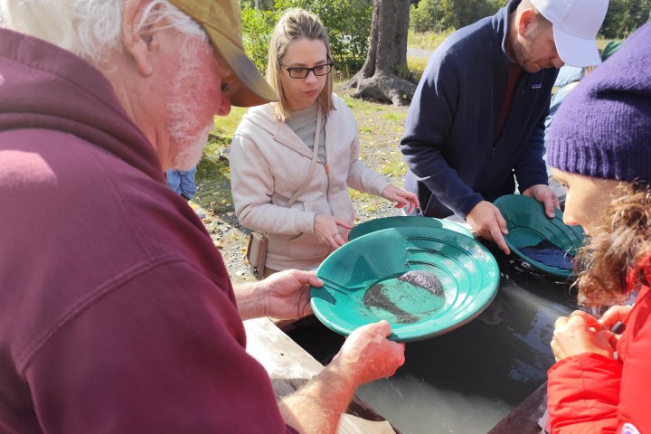 a group of people around each other