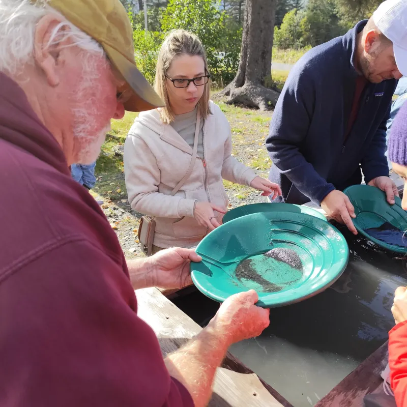 a group of people around each other