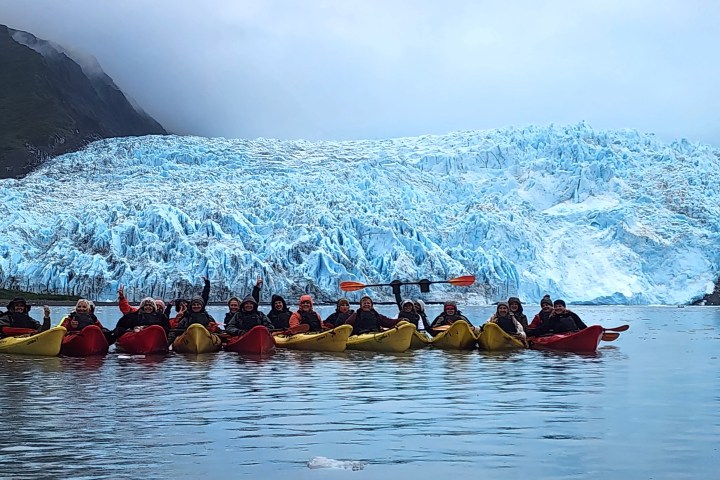 a group of people on a boat in the water